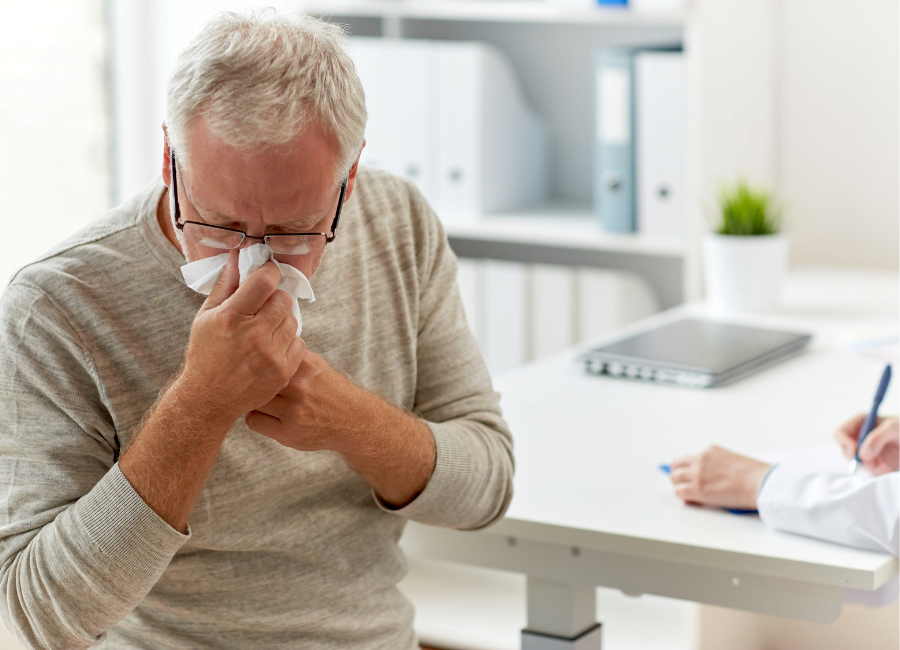 Man blowing nose